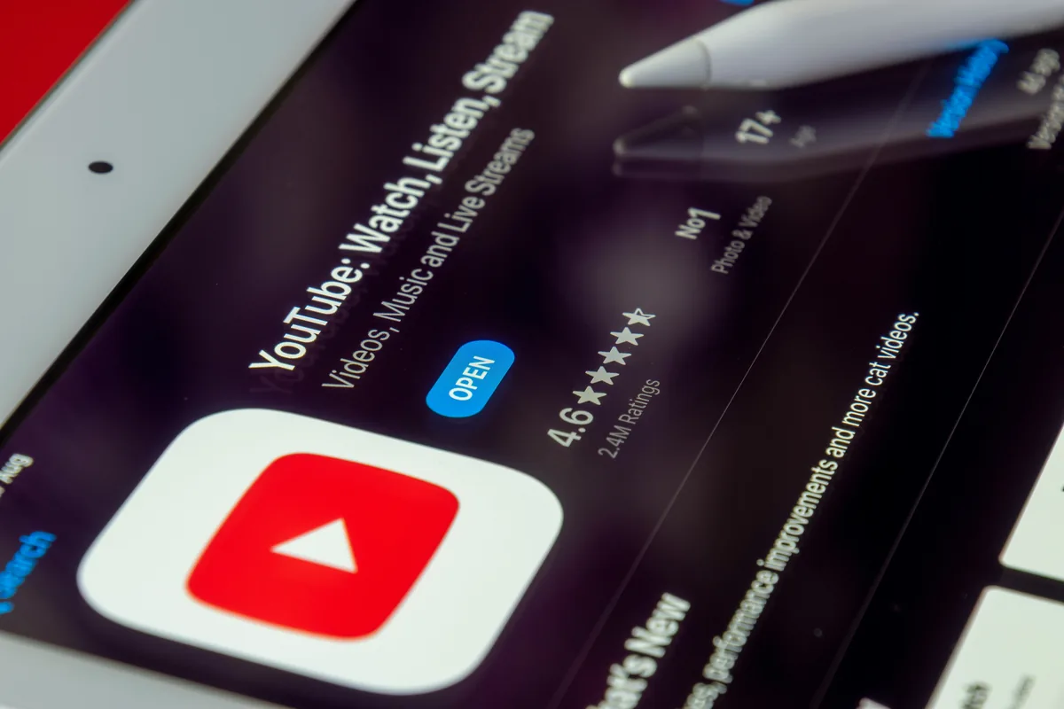 How to master YouTube — creator recording a video with microphone